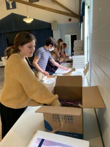 Youth helping pack Advent boxes