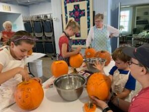 Carving pumpkins at Fall Fun Day
